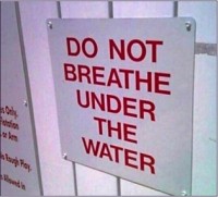 Sign saying DO NOT BREATHE UNDER THE WATER
